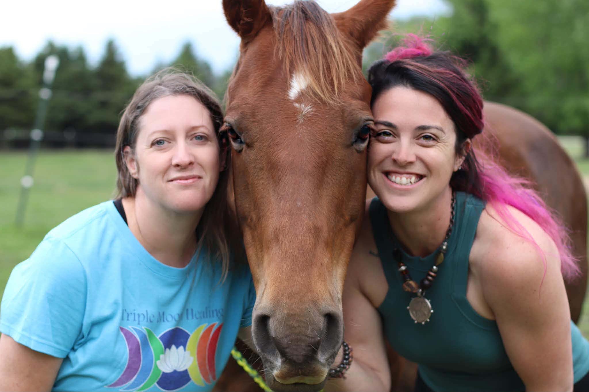 Two Unbridled facilitators with a horse
