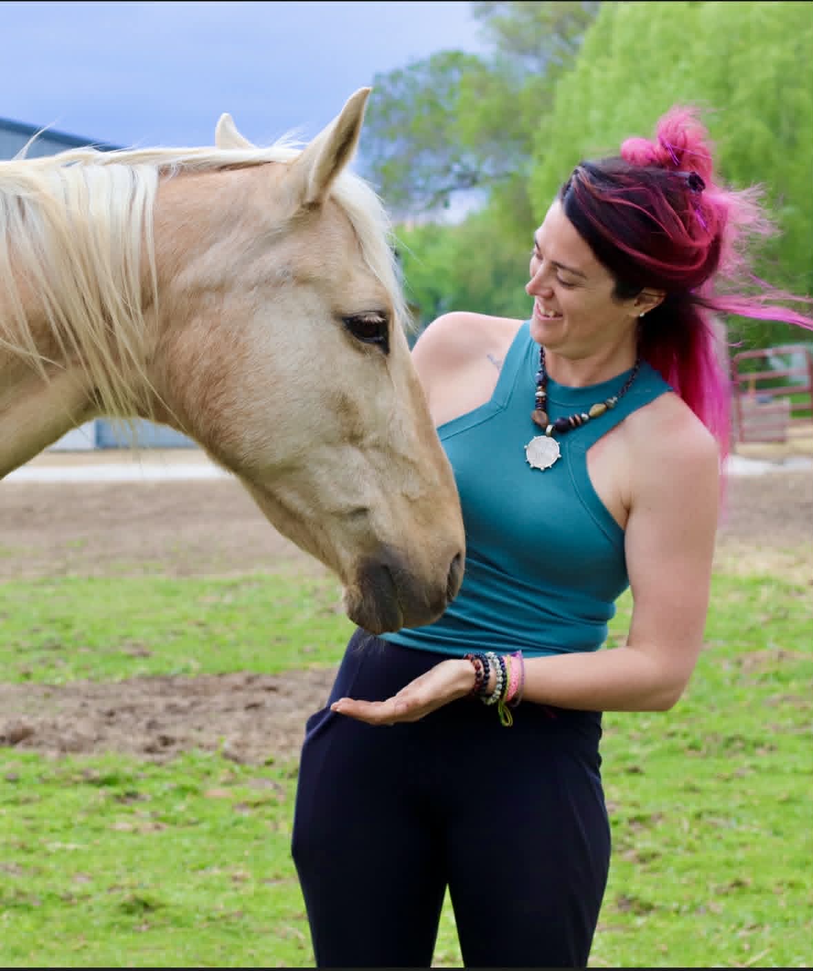 Shayna Woods laughing with her horse